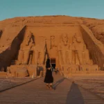 Traveller in front of the Great Temple in Abu Simbel