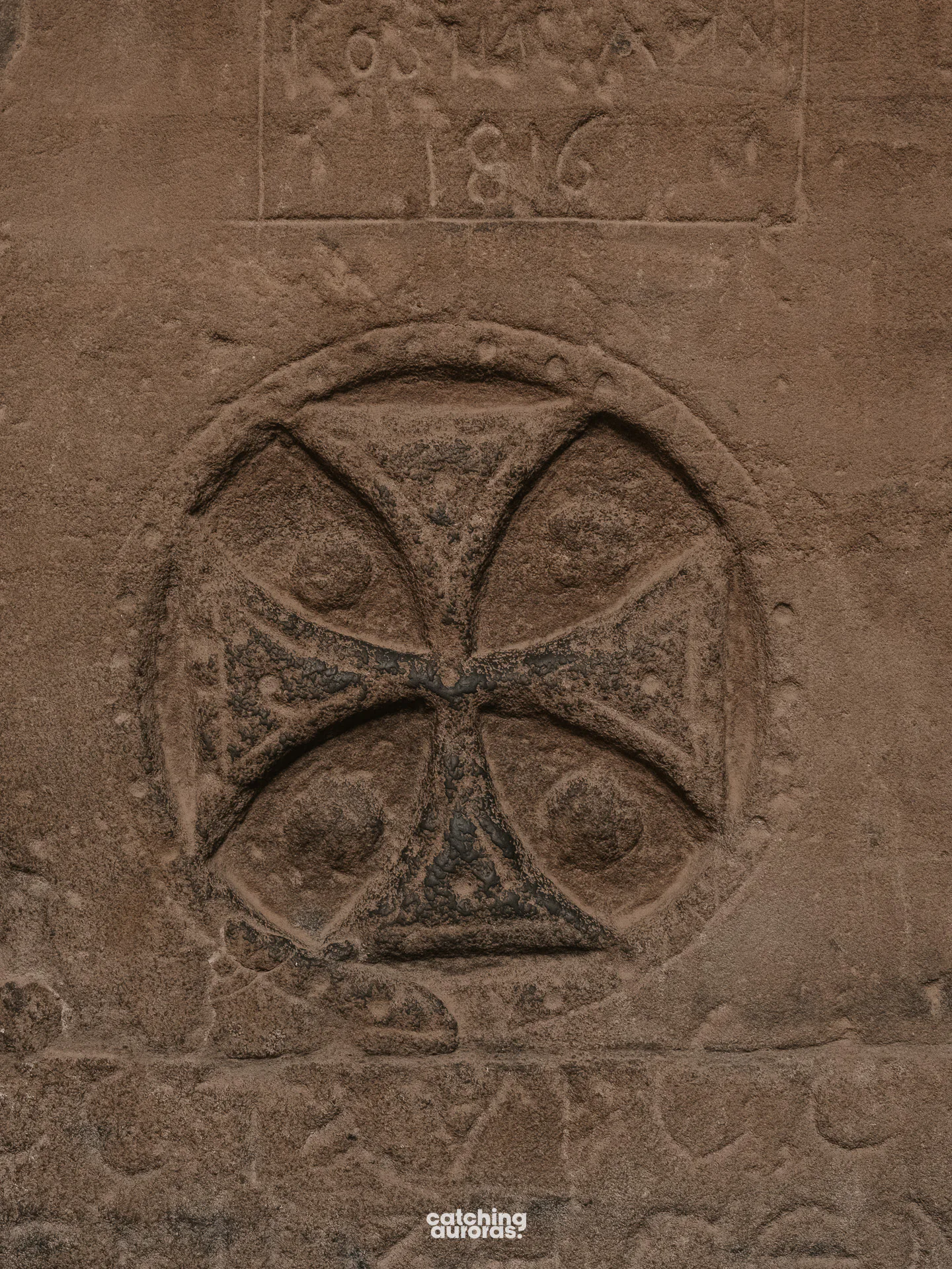 Coptic crosses carved over older Egyptian reliefs inside Philae Temple, Aswan, Egypt.