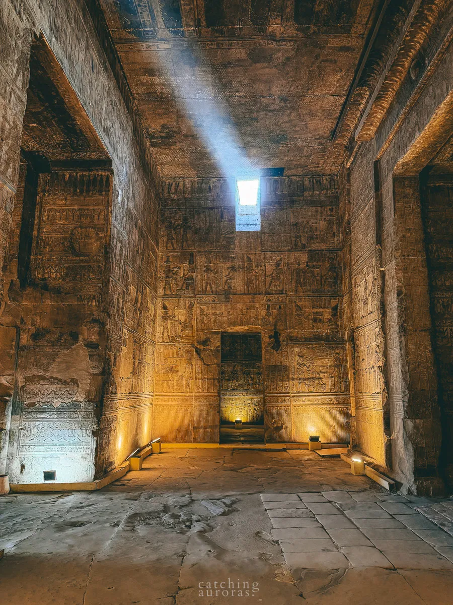 Sunlight pours in from an opening in the ceiling of a side room in Dendera temple