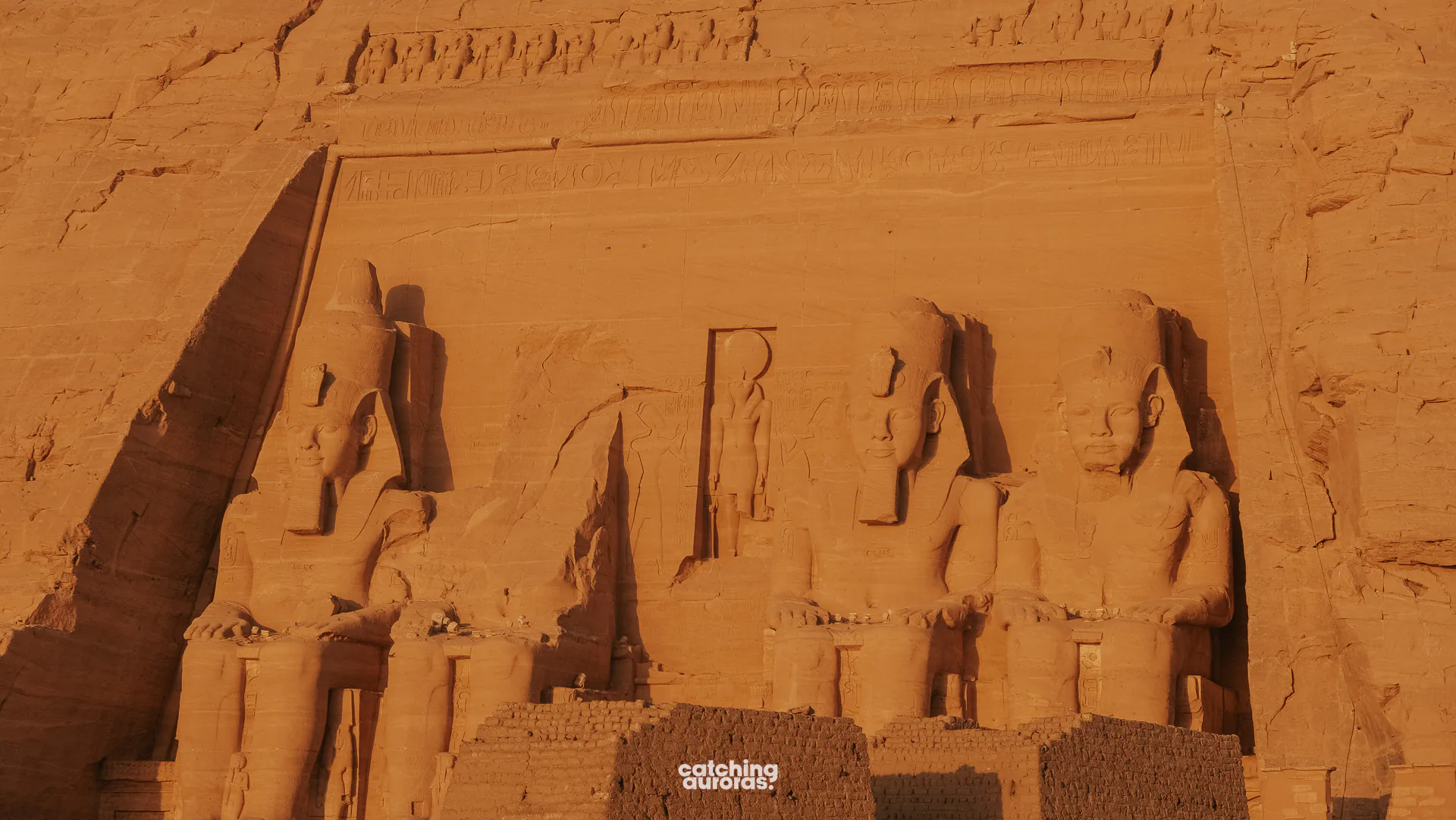 Four seated colossi of Ramesses II cut into the cliff at the Great Temple of Abu Simbel, Egypt.