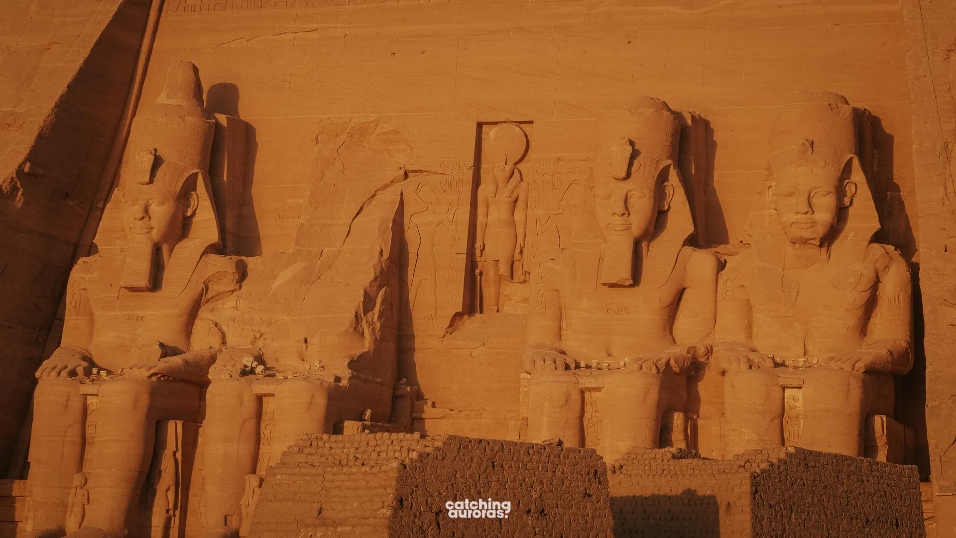 Four seated colossi of Ramesses II cut into the cliff at the Great Temple of Abu Simbel, Egypt.