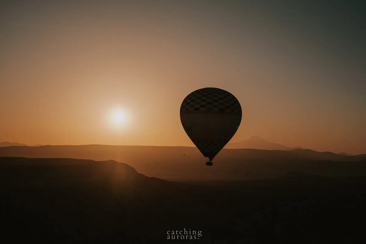 Hot Air Balloons silhouetted by the sun