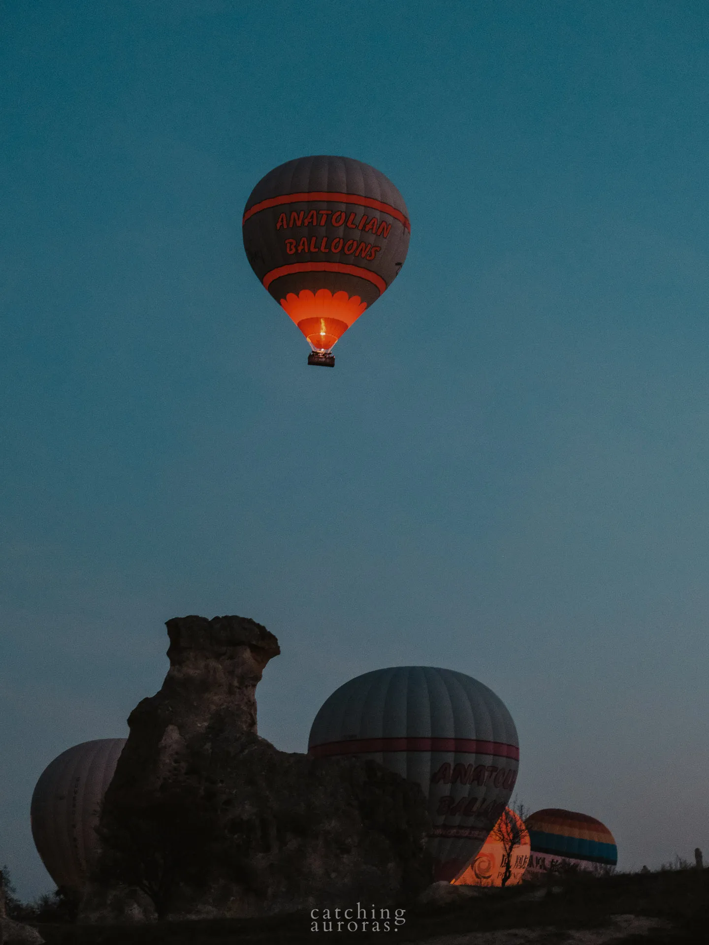 Cappadocia hot air balloons rising at sunrise