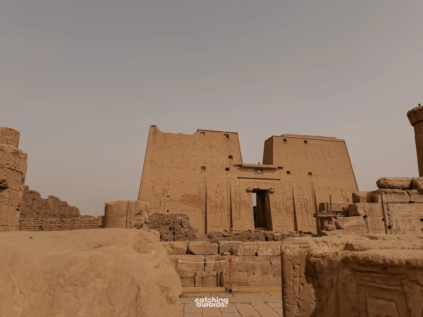 Massive entrance pylons of the Temple of Horus at Edfu, carved with figures of the king and gods
