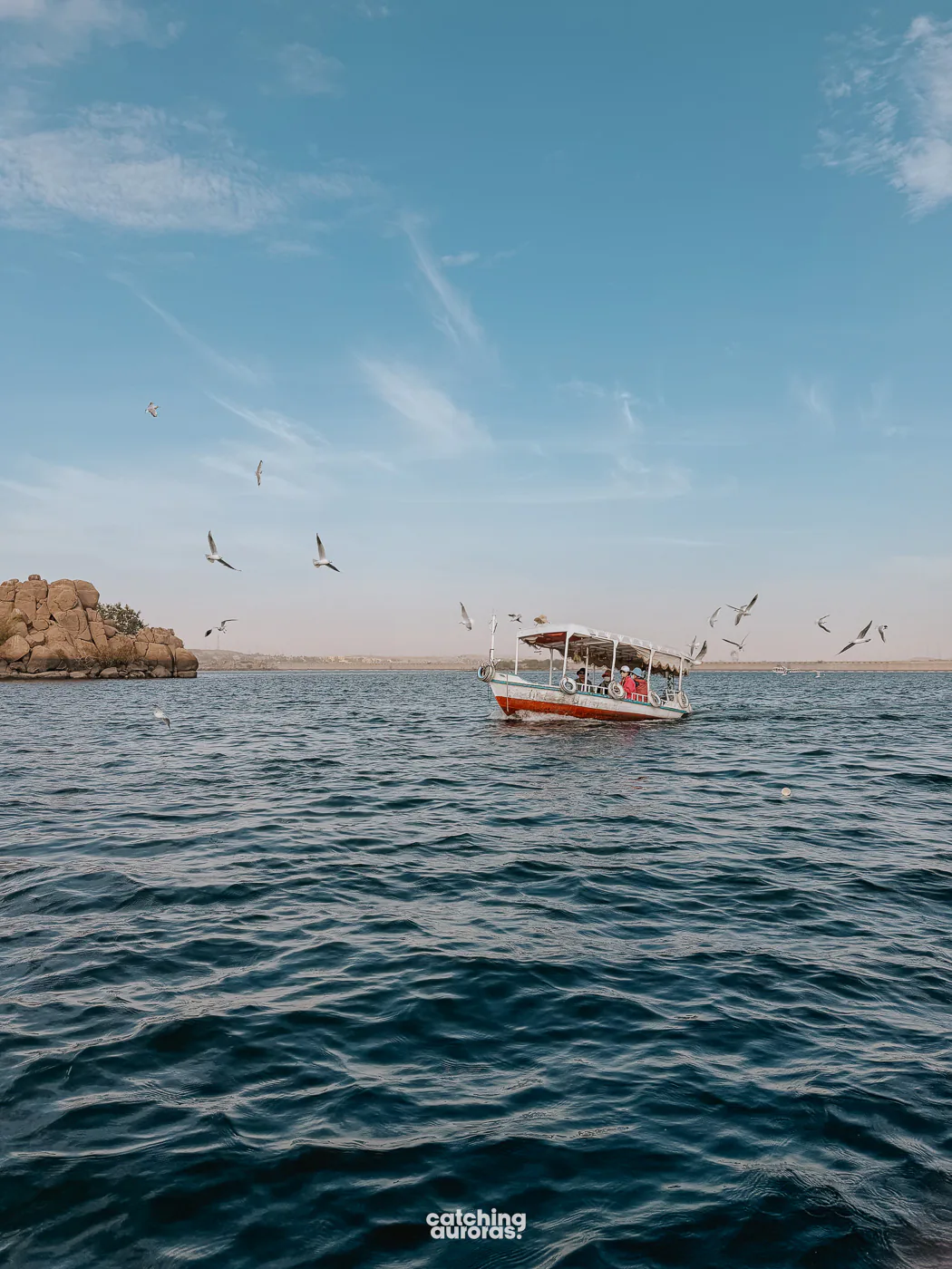 Motorboat crossing the Nile toward Philae Temple on Agilkia Island, Aswan, Egypt.