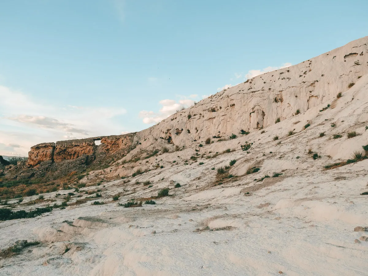 A photo of travertines which are dry and grey