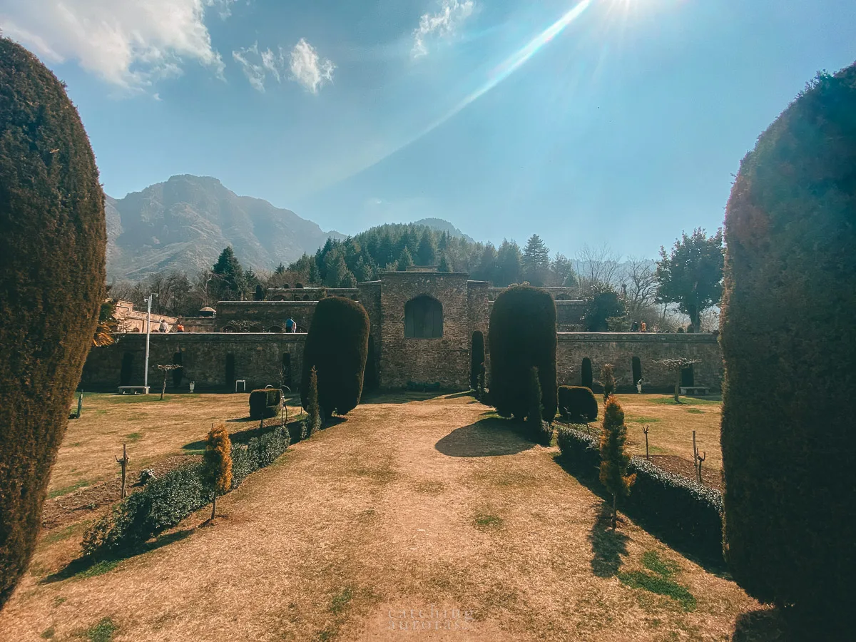 Front view of Pari Mahal, a Mughal fort surrounded by a landscaped garden.