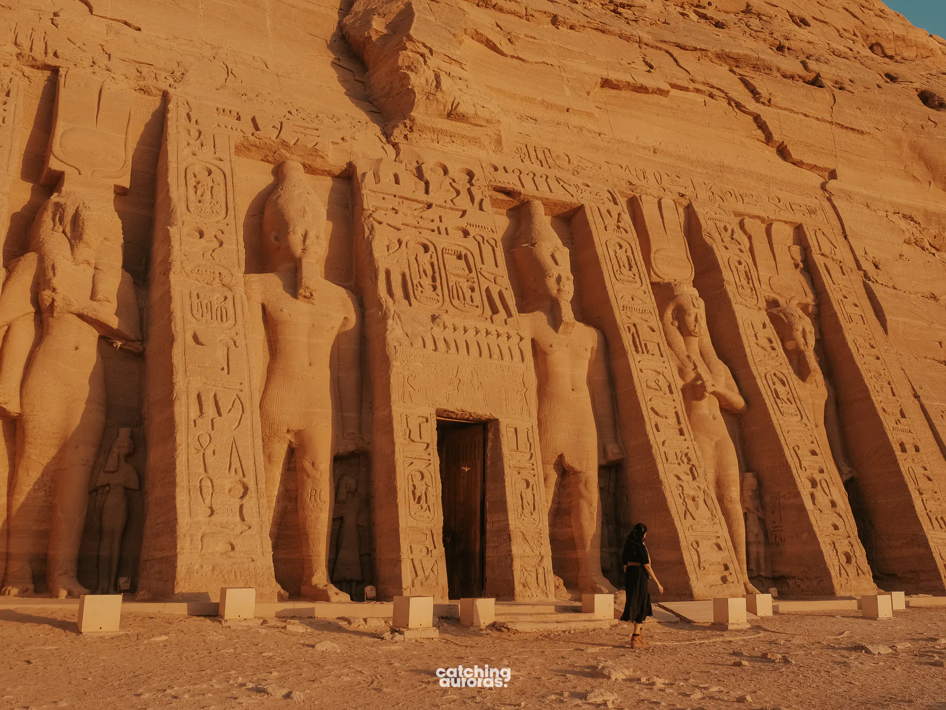 Standing statues of Ramesses II and Nefertari on the facade of the small temple at Abu Simbel, Egypt.