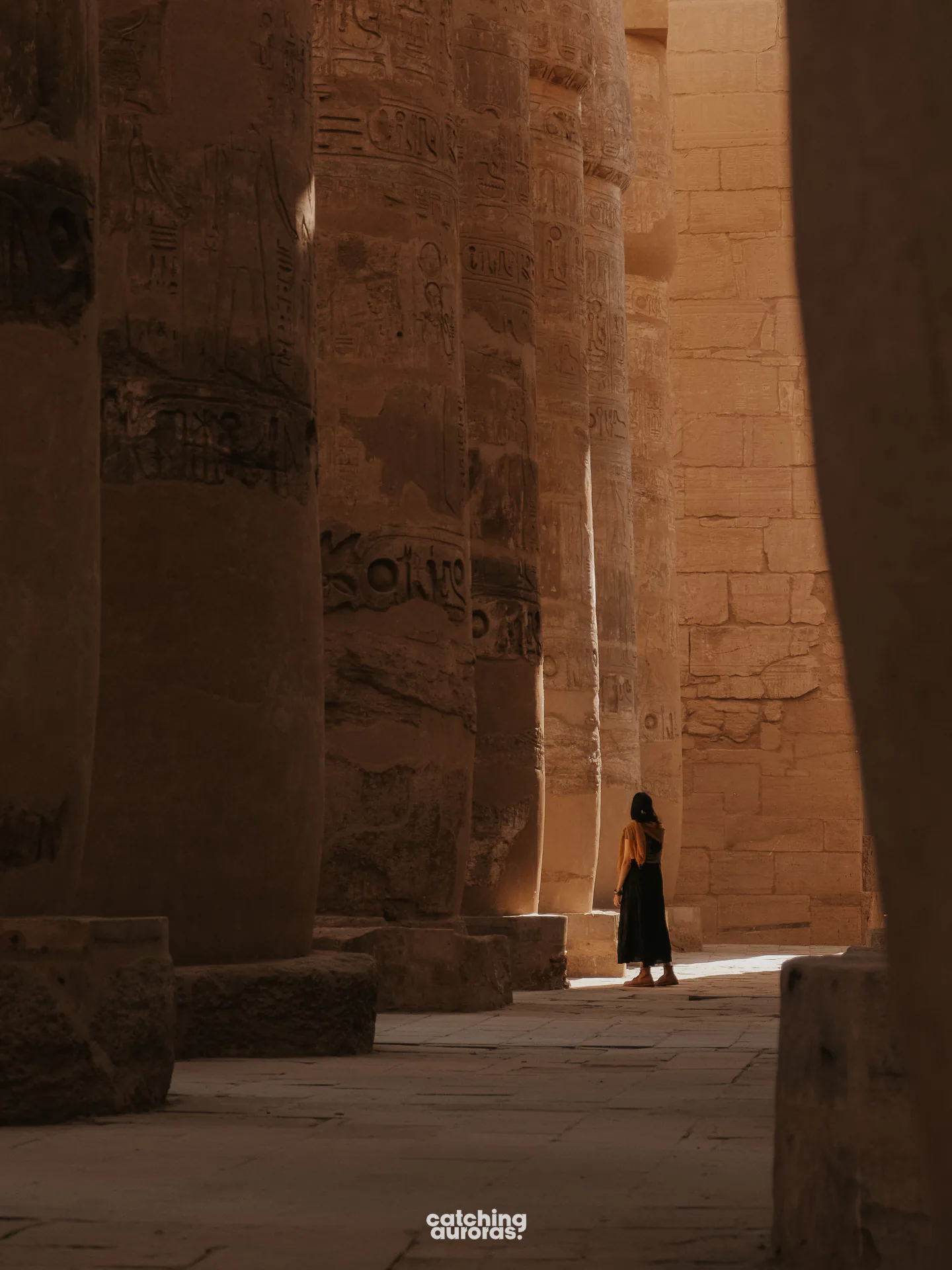 Walking amidst the Hypostyle Hall in Karnak Temple in Luxor, Egypt